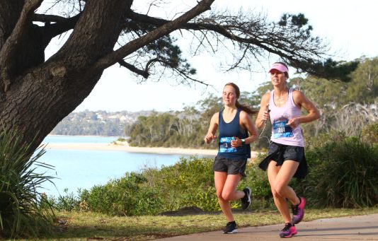 Runners compete in Husky half marathon along the shores of Jervis Bay