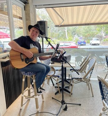 Dave Newman entertains at the Sandbar restaurant in Huskisson