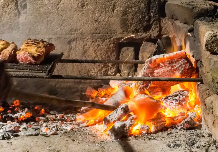 Dine on wood-fire grilled delights from Bud's Tavern and Old Salt Distillery. Photo: Adobe Stock