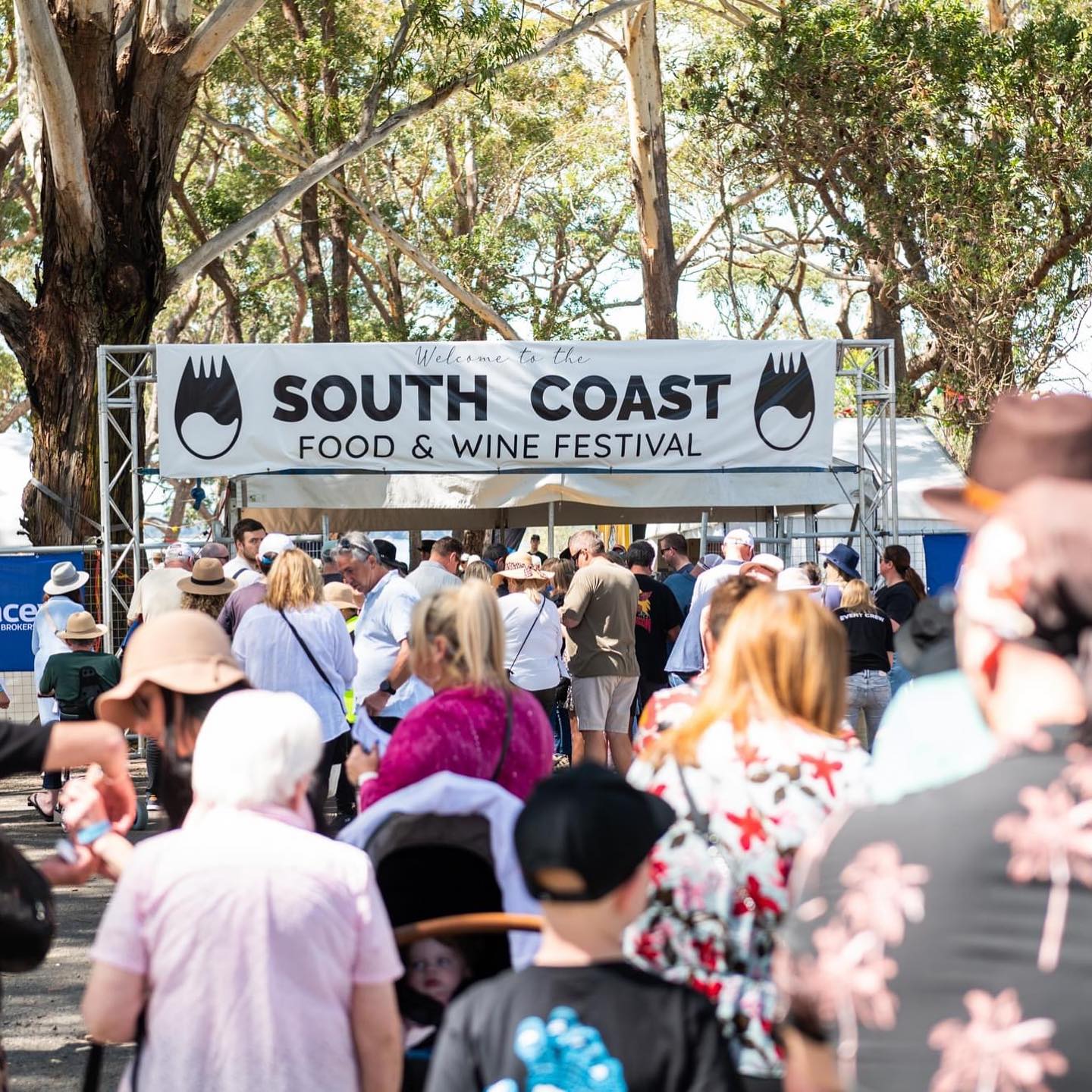 Welcoming banner at the entrance to the South Coast Food and Wine Festival at Moona Moona Creek Reserve, Huskissonq