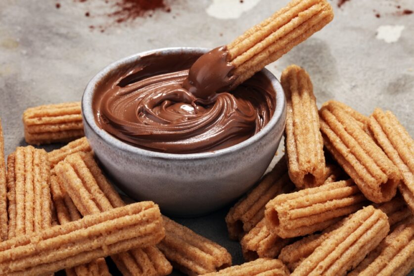 Brunch at The Waterfron Bar finishes with classic Spanish churros and chocolate sauce. Photo: Adobe Stock