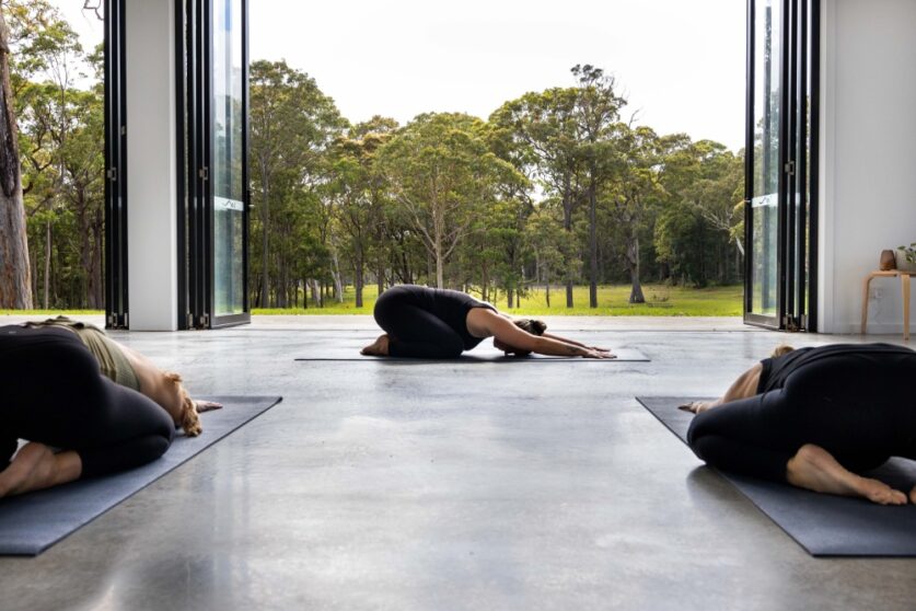 Practising yoga with a beautiful view of the bush in Jervis Bay