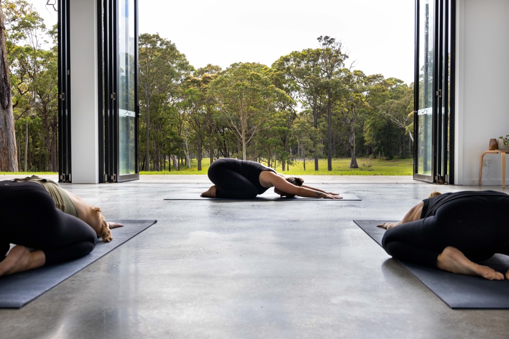 Practising yoga with a beautiful view of the bush in Jervis Bay