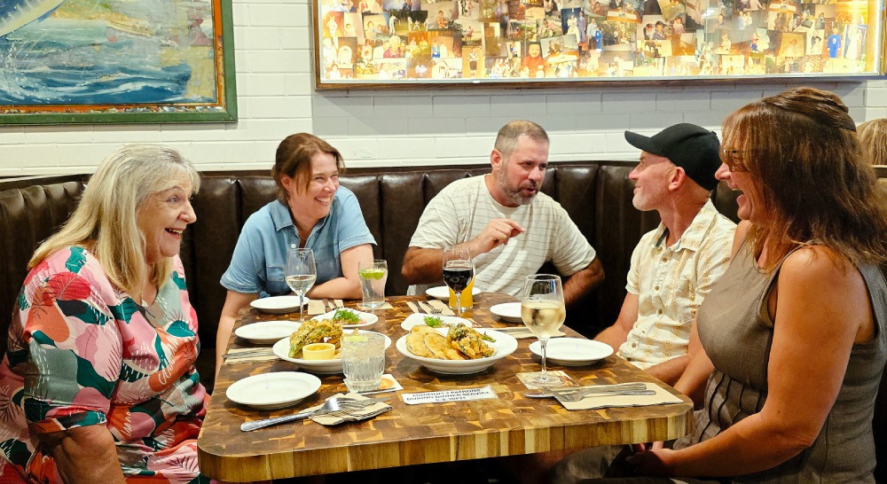 Friends sharing a Filipino feast at Filo Monday, Bud's Tavern Huskisson. Photo Narrell Tabone