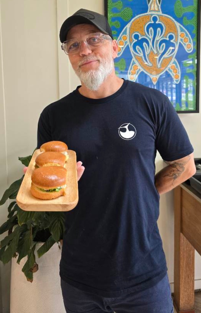 Huskisson Hotel executive chef Anthony Telford with a plate of prawn sliders. Photo Narrell Tabone.