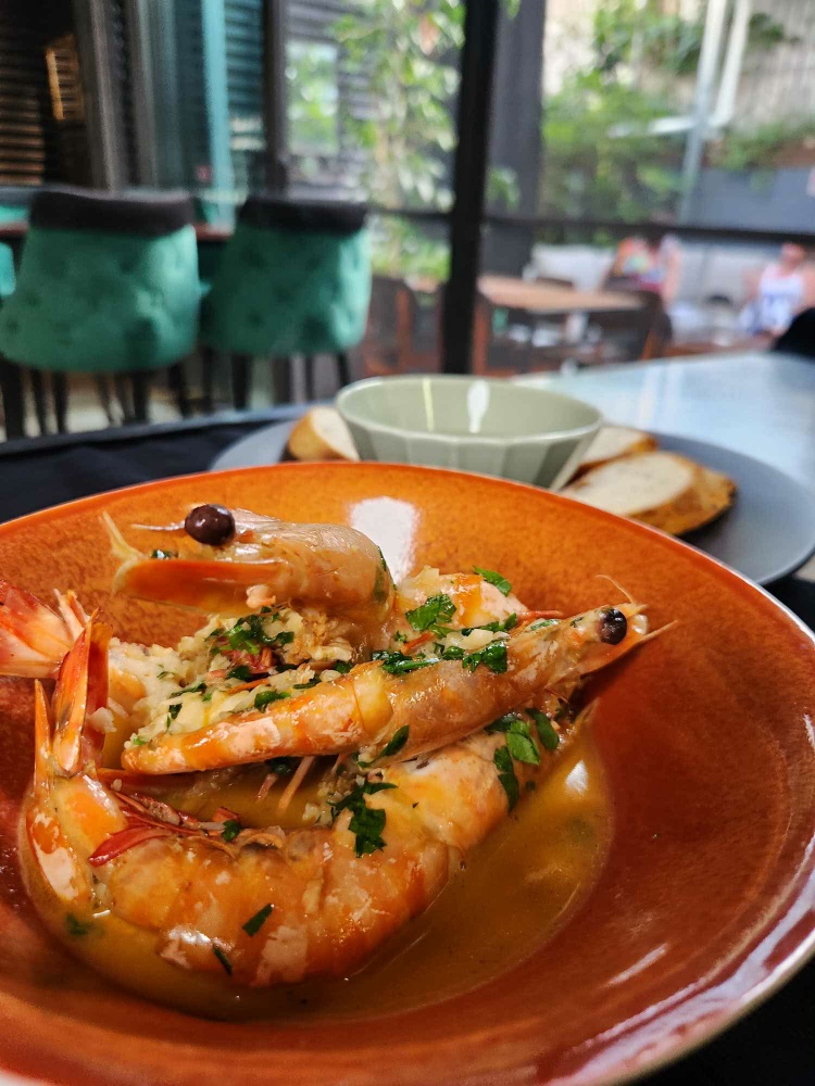 Pan fried "mammoth" prawns with loads of garlic are a firm favourite at Old Salt Distillery & Restaurant in South Nowra. 