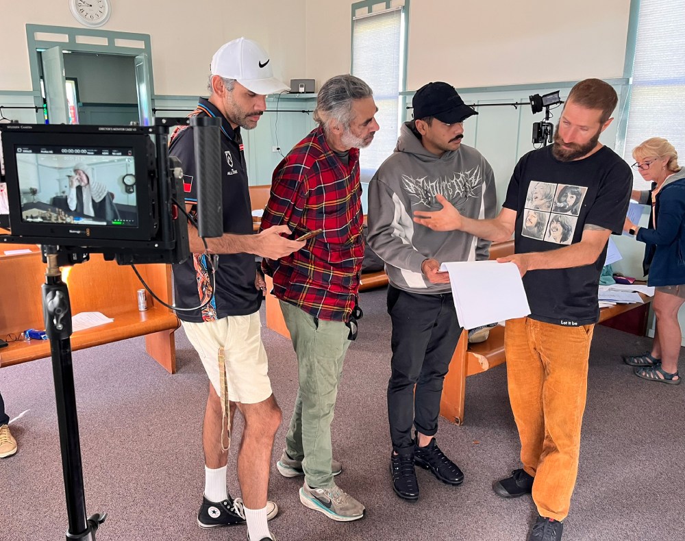 On set filming The Rock, Luke (L) collaborates with the crew. Photo Matt Loft