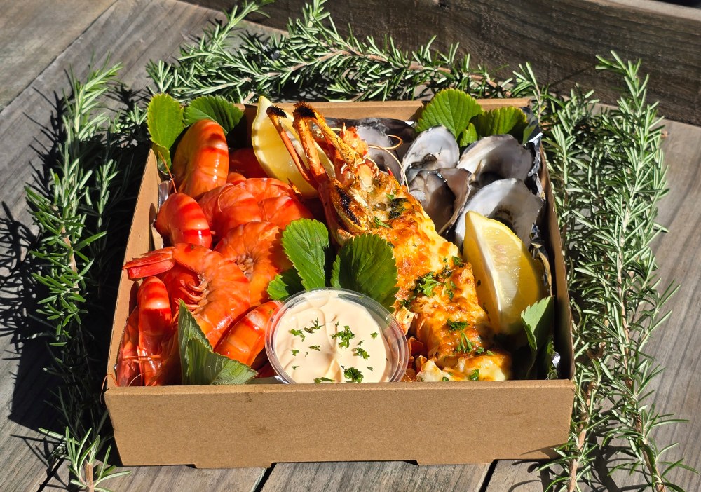 Fresh prawns and oysters from Jervis Bay Shellfish Market in Woollamia ready for a coastal picnic.