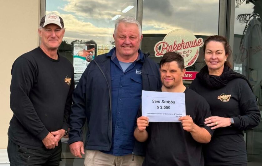 Sam Stubbs receives a gift from the local business community via Huskisson Chamber of Commerce & Tourism and his employers Husky Bakery. L to R Troy Bryce, Peter Palmer president of the Chamber, Sam Stubbs, Justine Bryce