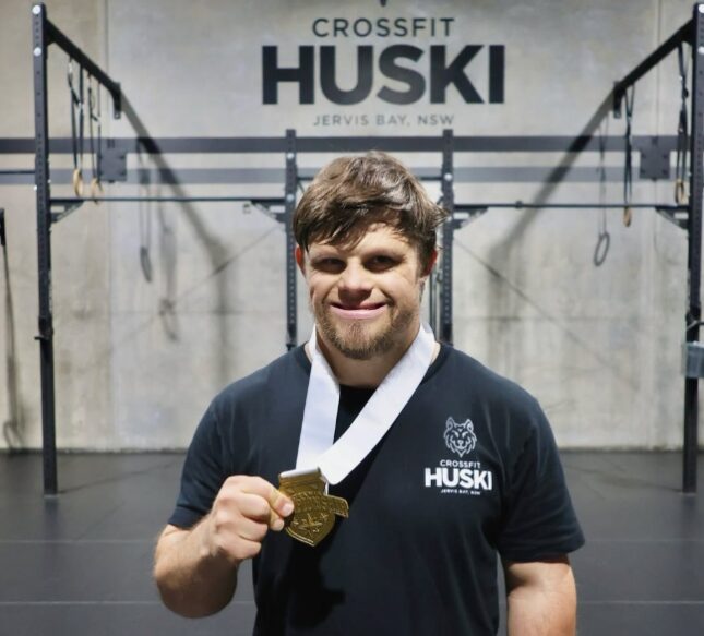 Sam Stubbs at CrossFit Huski with his medal from the Oceania CrossFit Games.